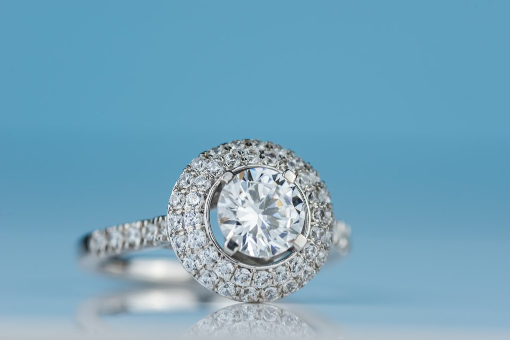 Closeup of double halo diamond engagement ring studio shot