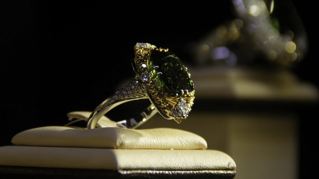 Jewelry with emeralds and diamond. Gemstones. Gold ring with emerald