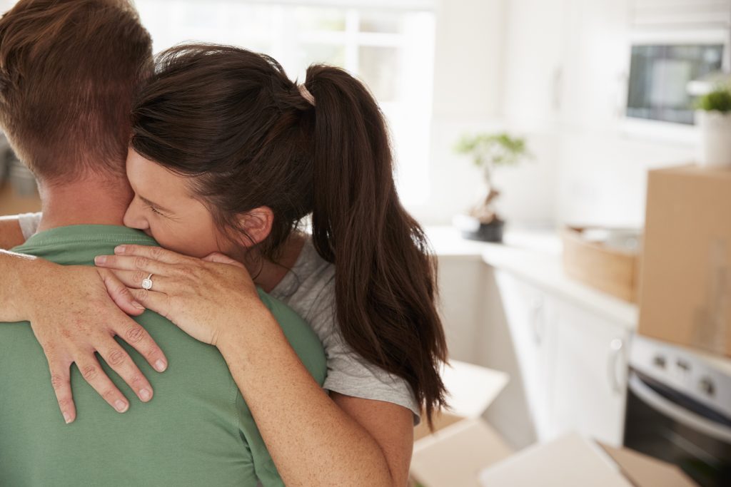 Loving Couple Celebrating Engagement At Home