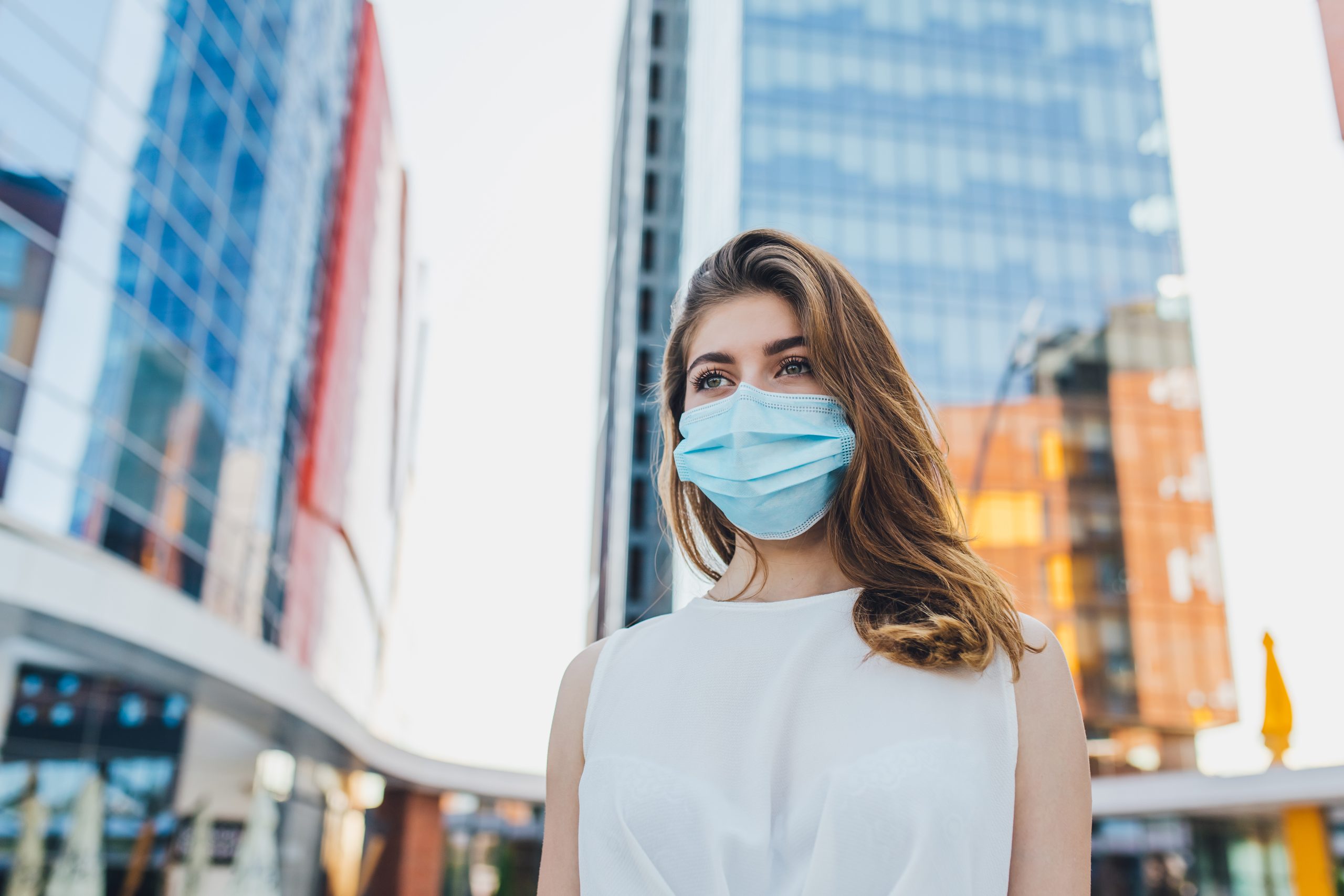 portrait of young woman with mask for protection from coronavirus outbreak