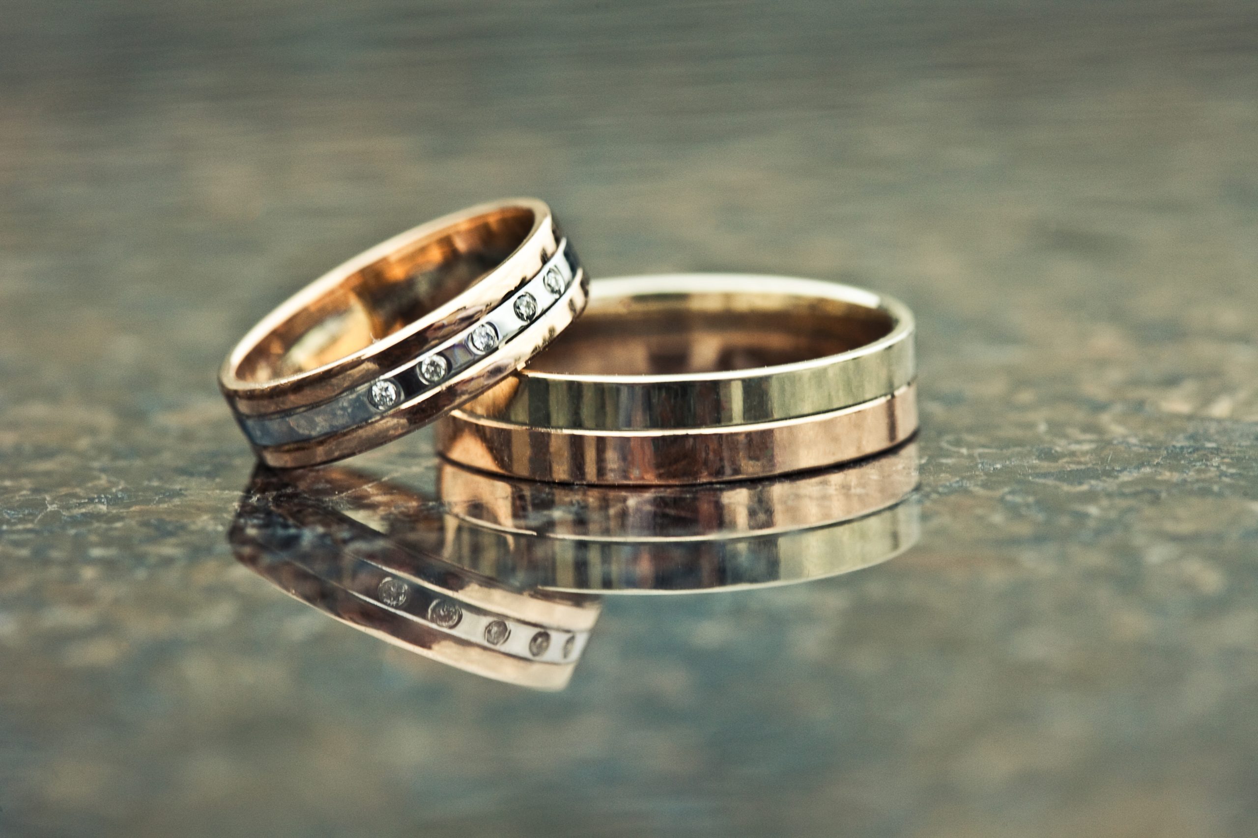 Two gold wedding rings of white and yellow gold